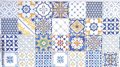 typical sicilian floor and wall tiles in different patterns and design in blue, yellow and white color