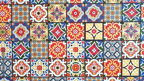 typical colorful traditional sicilian bright floor and wall tiles with different patterns and designs photo
