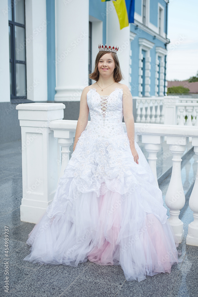 Girl with Down syndrome in wedding dress. Girl with Down syndrome in wedding dress.