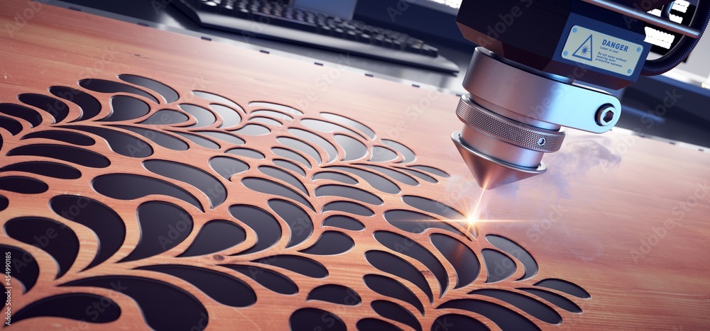 Laser cutter close up, cutting flower patterns on a wooden board.  - obrazy, fototapety, plakaty 