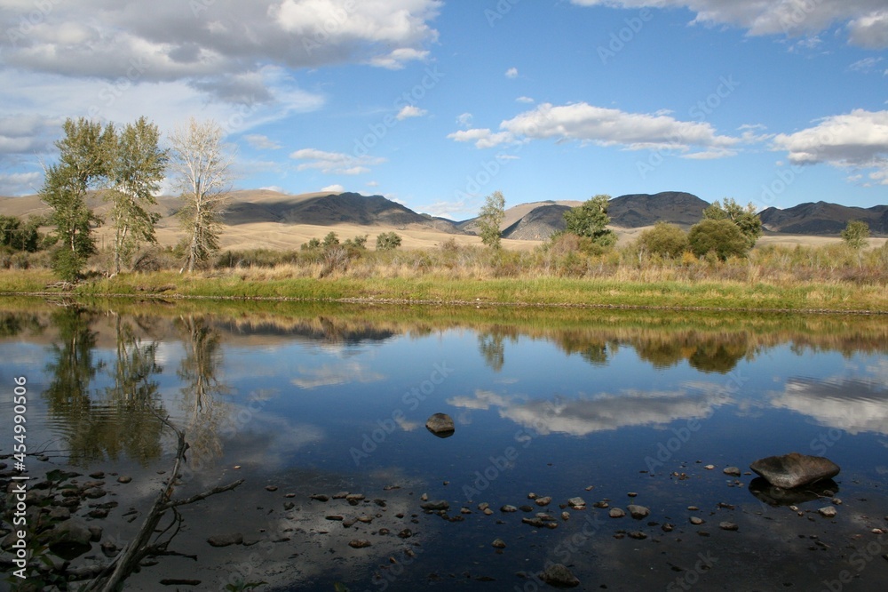 Big Hole River fall reflection of clouds in Montana Big Hole River fall reflection of clouds in Montana