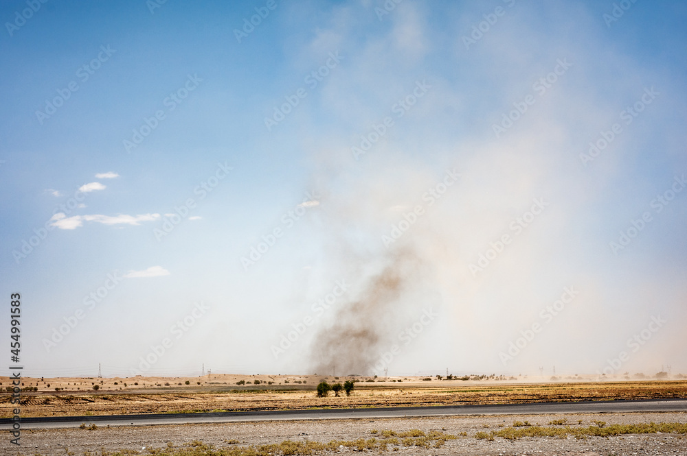 Small tornado or whirlwind with dust in a field
