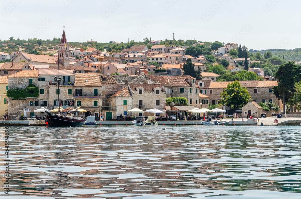Fototapeta premium Picturesque bay and the old town of Postira. Postira lies on the northern coast of Brac island in Croatia.