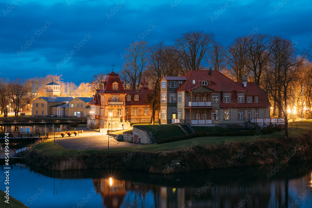 Kuressaare, Estonia. Old Wooden Mansion Ekesparre Boutique Hotel In Wooden Art Nouveau In Evening Blue Hour Night