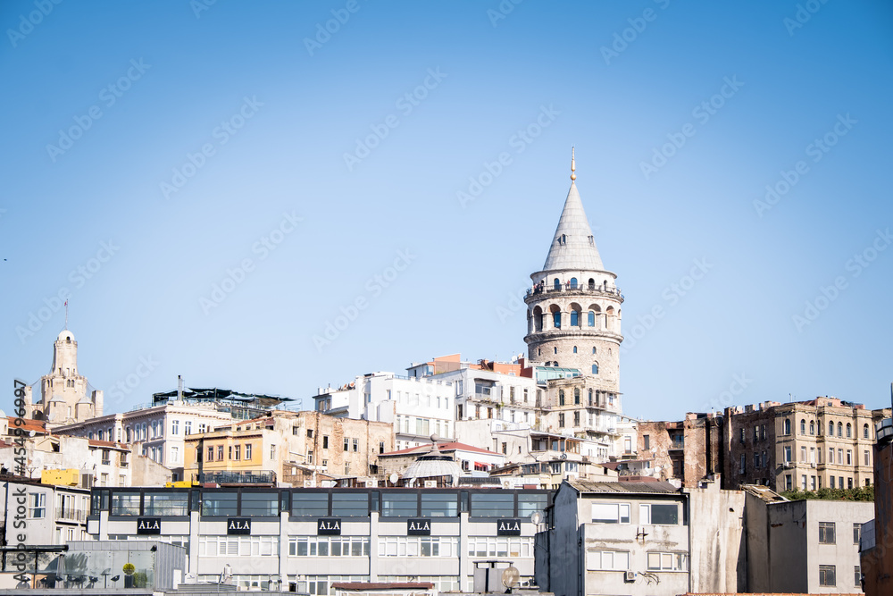 Galata tower, one of the historical towers of Istanbul. It is one of the most important places in Istanbul. Galata tower and historical buildings. Selective focus.