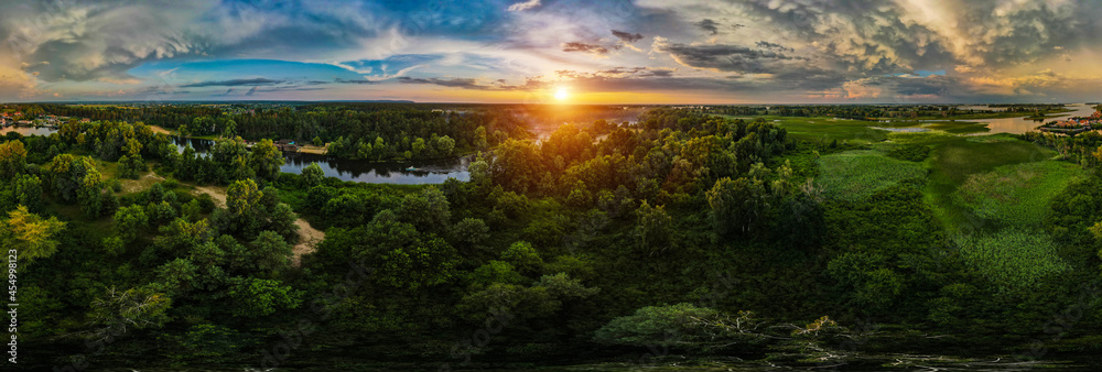 Landscape from above. Trees and river at sunset. Drone photo - obrazy, fototapety, plakaty 