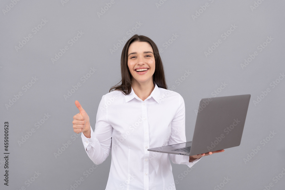 happy woman in white shirt hold computer and showing thumb up gesture, fast internet happy woman in white shirt hold computer and showing thumb up gesture, fast internet