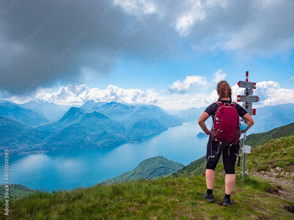 Trekking scene on Lake Como alps (the arrows indicates the names of the locations reached by the trails)