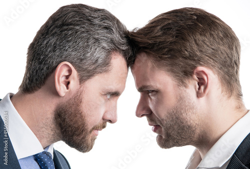 boss and employee. businessmen face to face. disagreed men partners. business competition