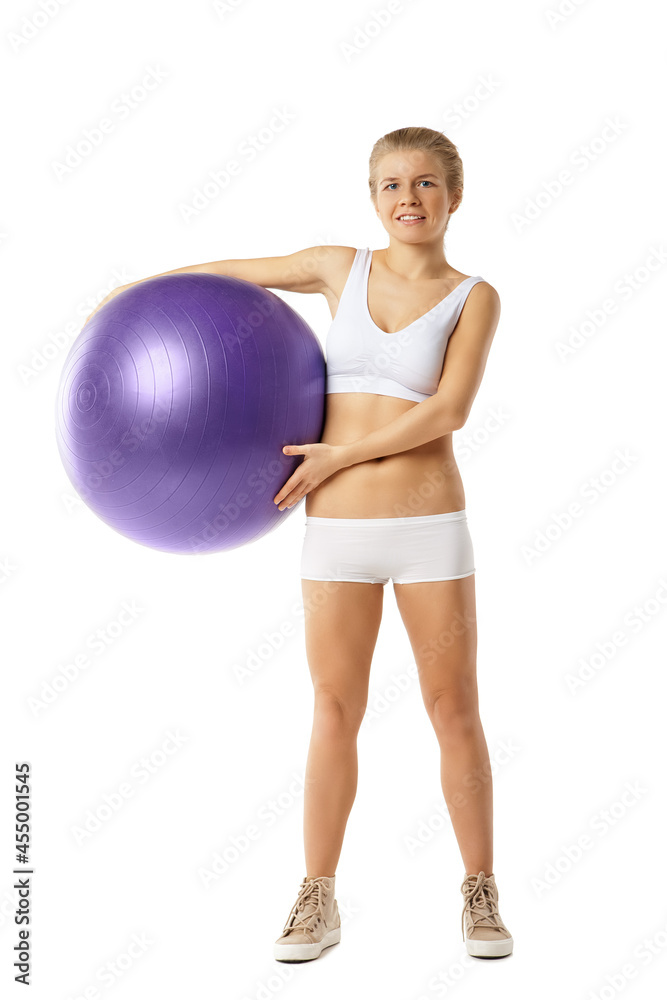 Young woman with fit-ball isolated over white Young woman with fit-ball isolated over white