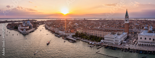 Magical evening sunset view over beautiful Venice in Italy. Aerial view of the Venice lagoon with a beautiful city view.