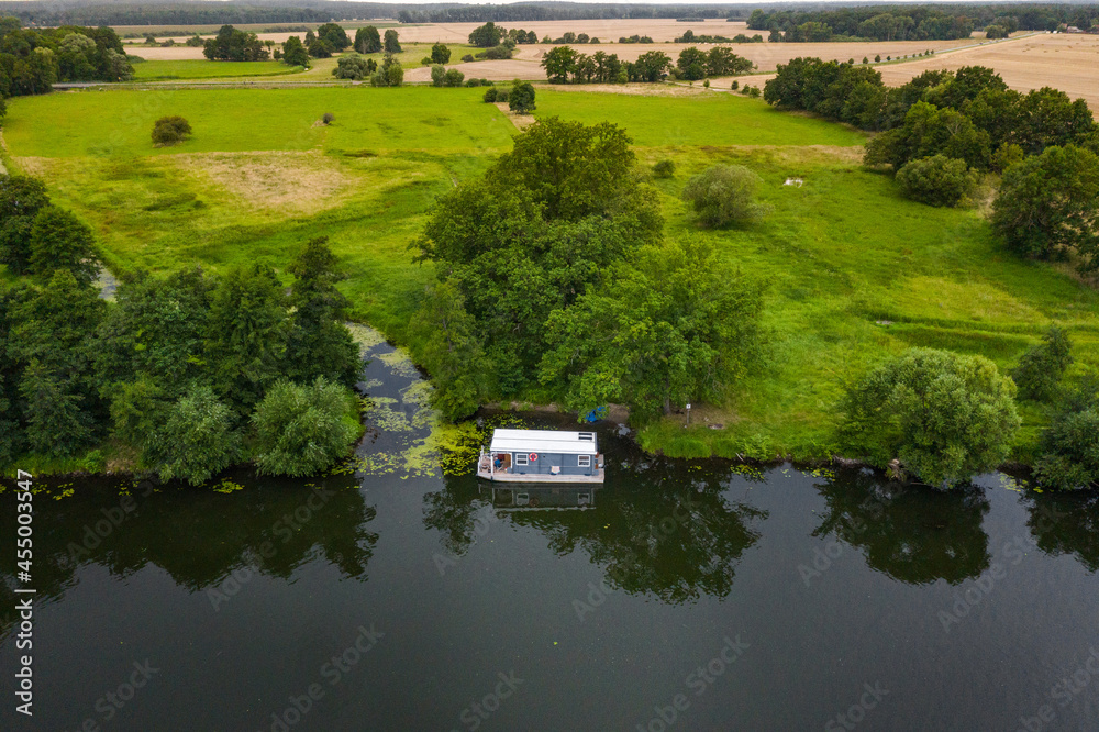 Fototapeta premium aerial view of houseboat in the river