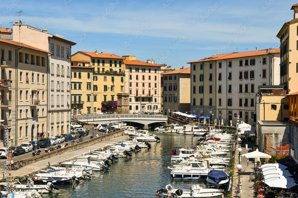 High-angle view of the canal harbour of the New Venice district with docked boats in summer, Livorno, Tuscany, Italy