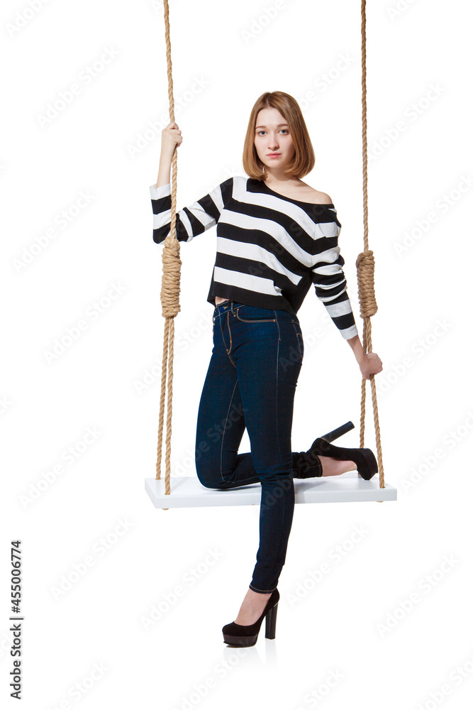 Beautiful girl swinging on swing. Isolated Beautiful girl swinging on swing. Isolated