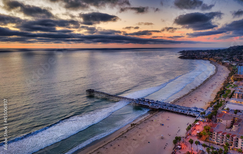 Drone image of Crystal Pier in San Diego during cloudy sunset.  photo