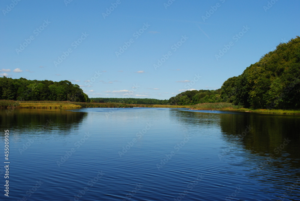 Calm river landscape with a clear blue sky