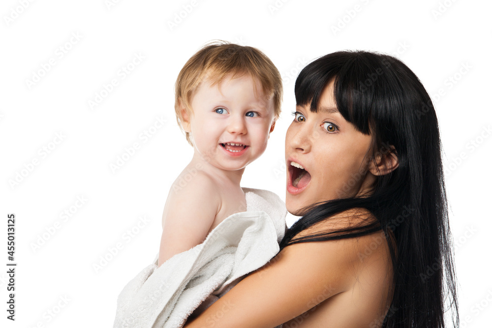 Young mother with her baby after bathing in a white towel Young mother with her baby after bathing in a white towel