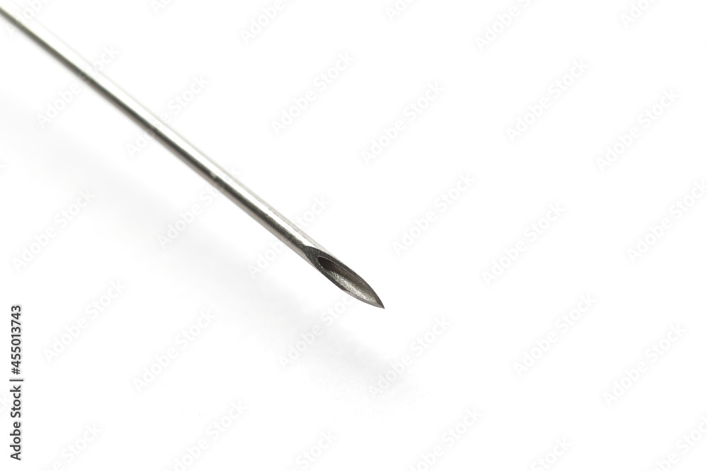 Close up of a syringe needle, macro photography of an hypodermic needle. Used for vaccine injection or blood extraction