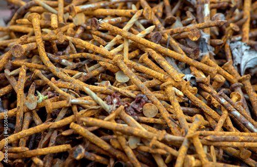 Pile of rusty nails sitting outdoors