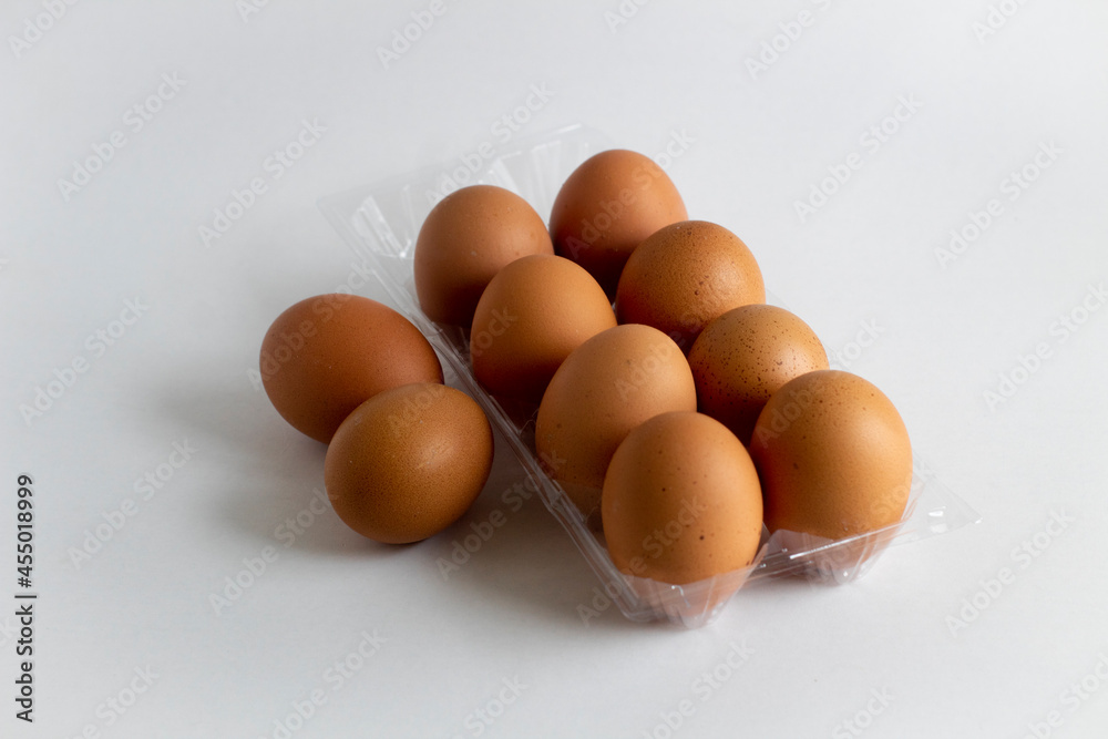 Some eggs and egg holder on white background Some eggs and egg holder on white background