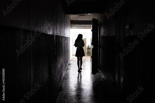 silhouette of a person in a tunnel
