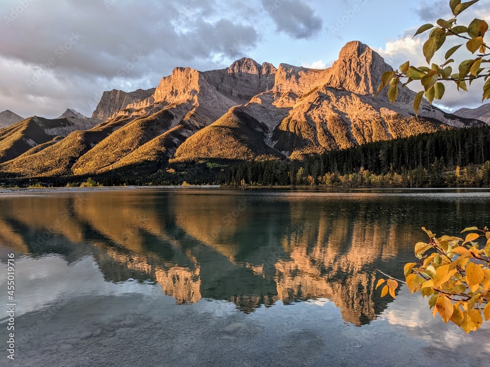 early morning golden mountain reflection