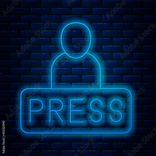 Glowing neon line Journalist news reporter icon isolated on brick wall background. Vector