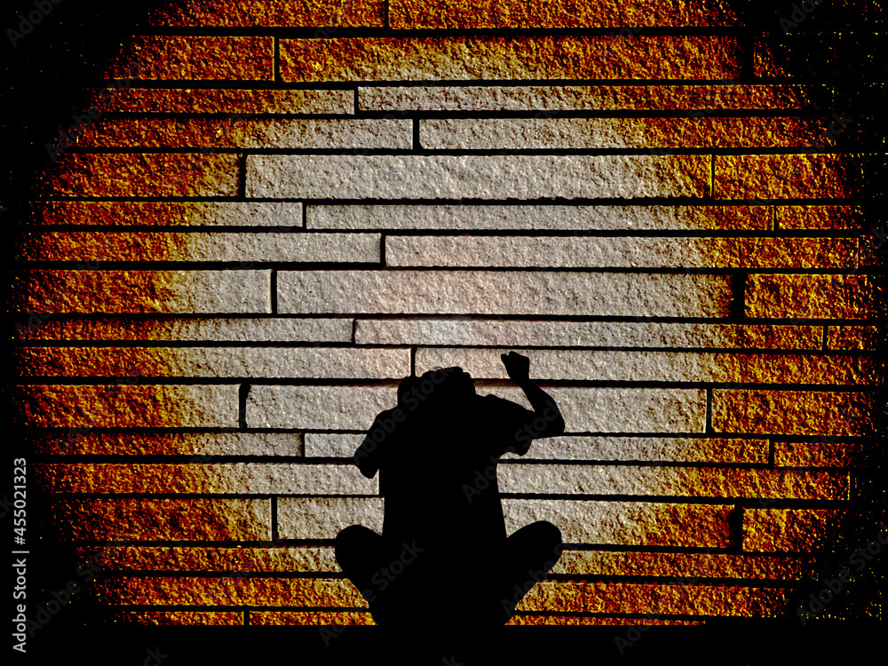 Obraz premium 壁をたたく男性シルエット