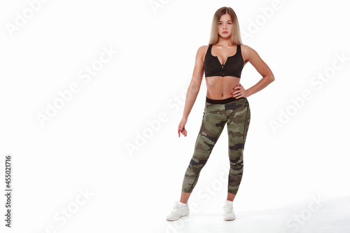 Sporty girl with a good figure on a white background