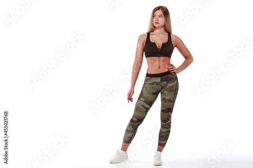 Sporty girl with a good figure on a white background