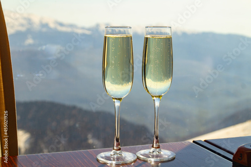 two glasses of champagne against the sky