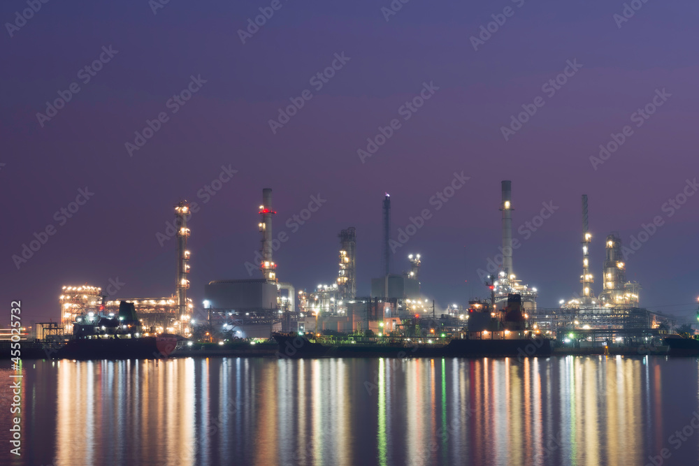 Industrial view Oil refinery and oil tanks plant during at twilight
