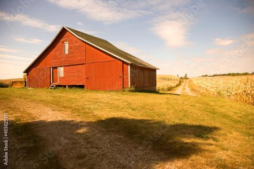 Photos Red barn sitting empty and abandoned on a farm in late summer in the midwest, US
