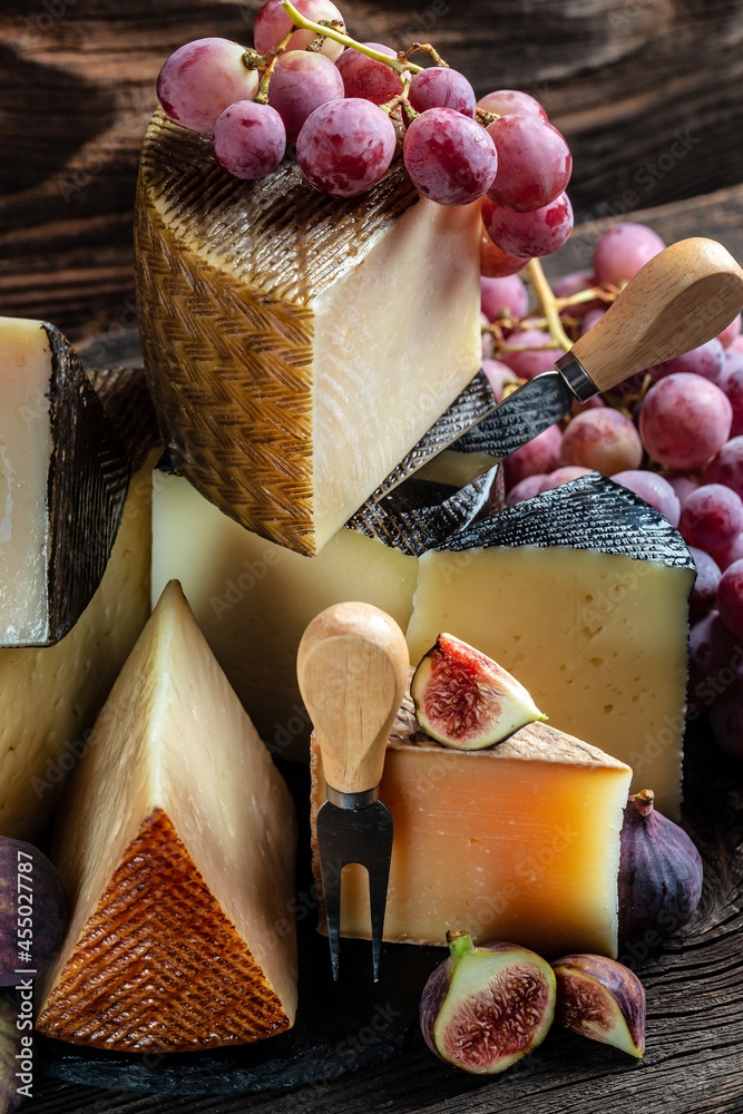 Cheese board of various types of soft and hard cheese. spanish manchego