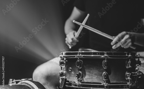 Canvas Print Close-up shot of a drummer playing a snare drum with sticks.