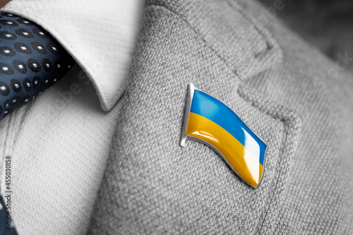 Fotografie Metal badge with the flag of Ukraine on a suit lapel