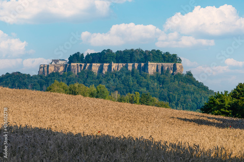 Wandern im Nationalpark  Sächsische Schweiz Pfaffenstein im Elbsandsteingebirge mit Blick zur Festung Königstein photo