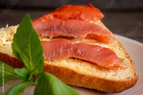 sandwich with red fish and basil