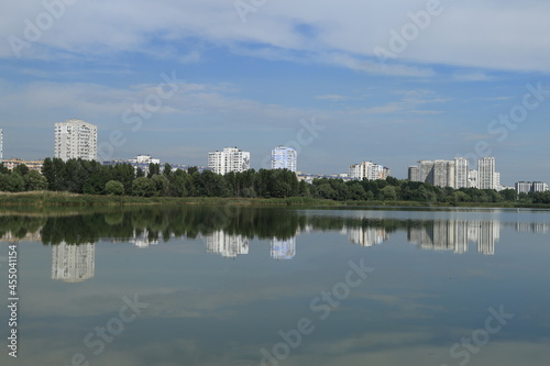 urban buildings on the shore of a large lake