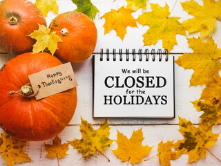 We will be closed on the Holidays. Close-up, view from above, no people. Congratulations for loved ones, relatives, friends and colleagues. Holiday concept
