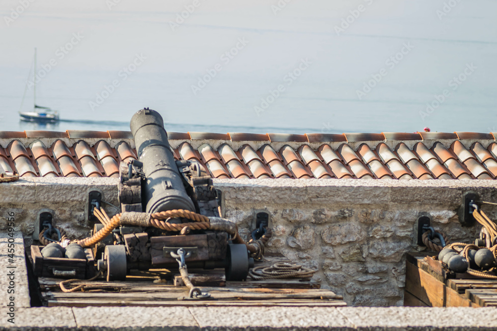 Old cast cannons on the walls of the old town.