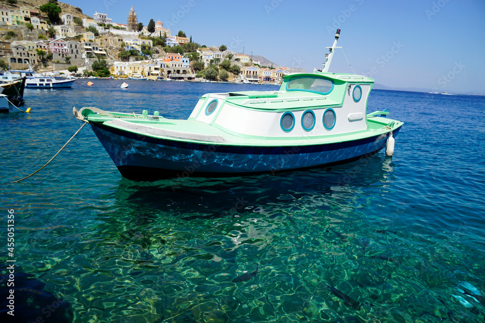 Fototapeta premium small boat in the harbor of symi