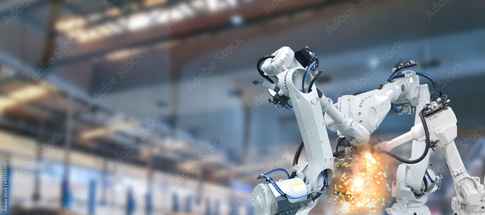 Robotic arm industry in parts manufacturing plants Stock Photo | Adobe ...