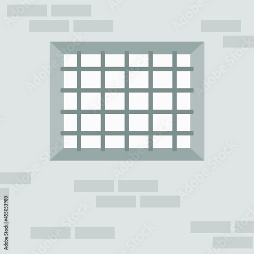 Barred window on brick wall background