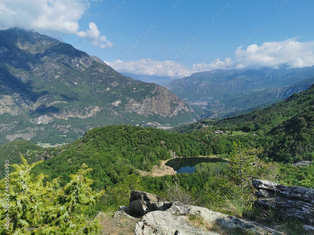 Panoramic aerial view of the valley of Dora Baltea river with the nice and small Villa lake on the mountain trail Monte Rosa Randò 