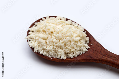 Bread Crumbs in wooden spoon on white background.