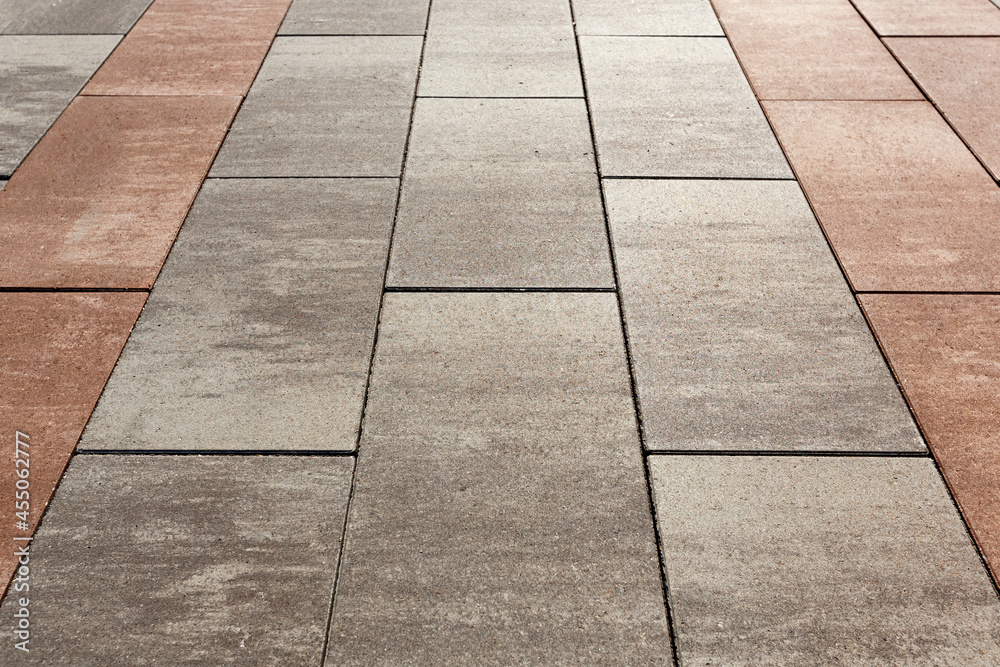 Obraz premium Visual zoning of space using paving with tiles of different colors. Selective focusing.
