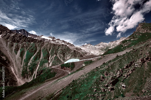 Elbrus area, Greater Caucasus Range. Elbrus, mountains in summer. Mountainous landscape, Elbrus, clouds. photo