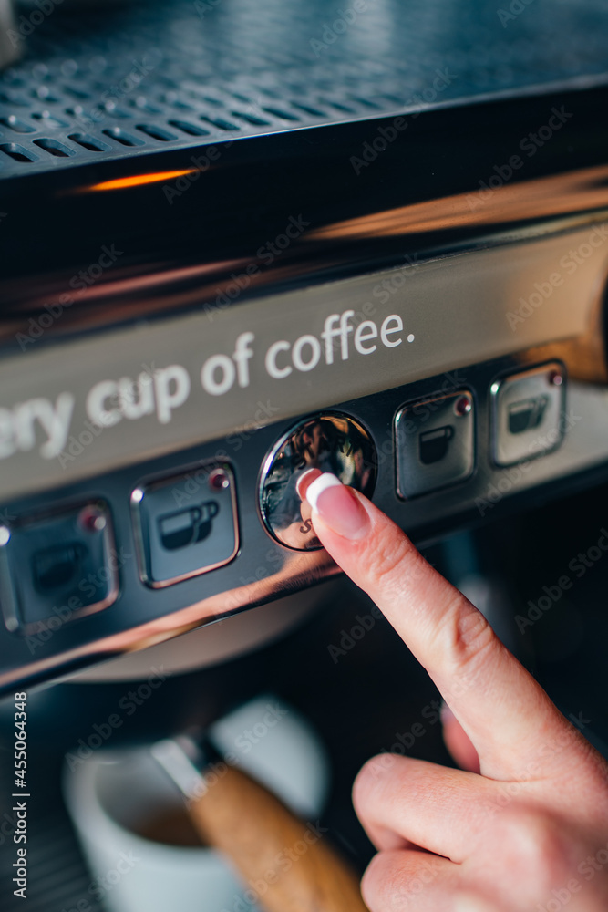 Obraz premium person making coffee on machine, button push, morning