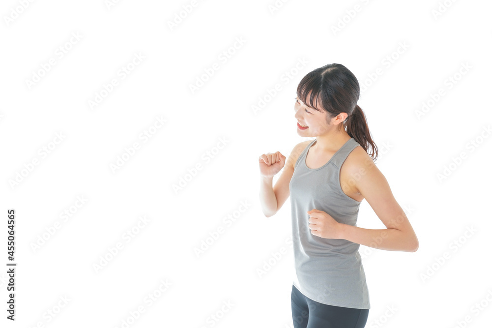 ランニングをする若い女性 ランニングをする若い女性